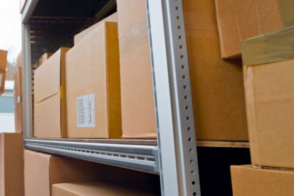 Cardboard boxes on a metal rack